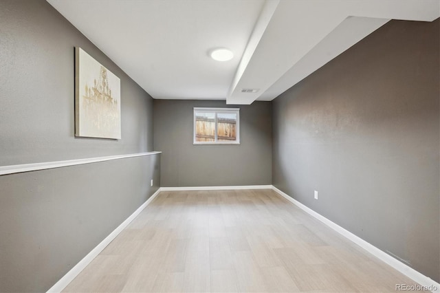 10909 W 65th Way, Arvada, CO 80004 - basement featuring wood finished floors and baseboards