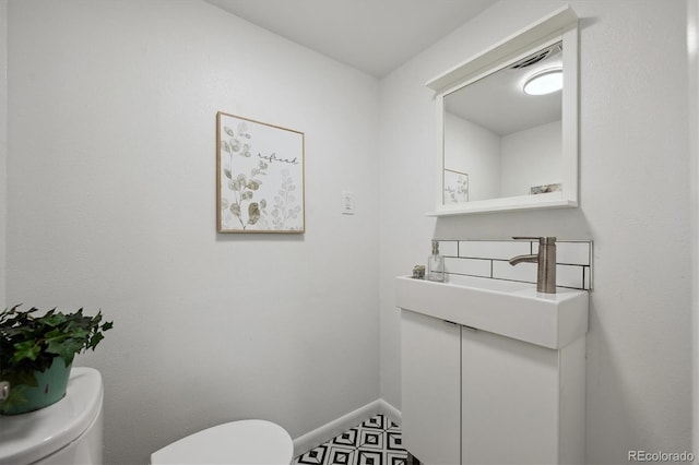 10909 W 65th Way, Arvada, CO 80004 - bathroom featuring toilet and baseboards