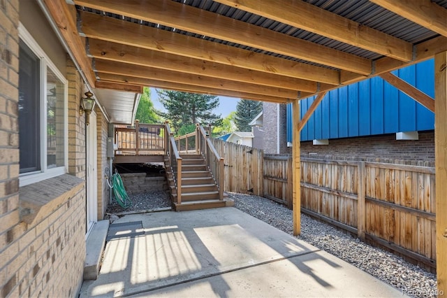 10909 W 65th Way, Arvada, CO 80004 - fenced backyard featuring stairs, a patio area, and a deck