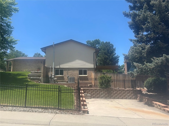 10909 W 65th Way, Arvada, CO 80004 - view of side of home with a patio area and brick siding