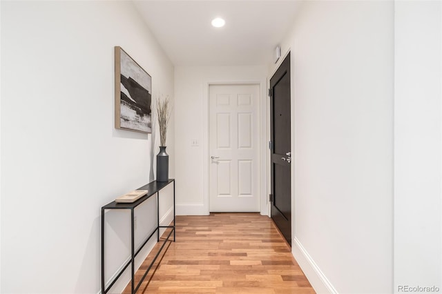 hall with light wood-type flooring