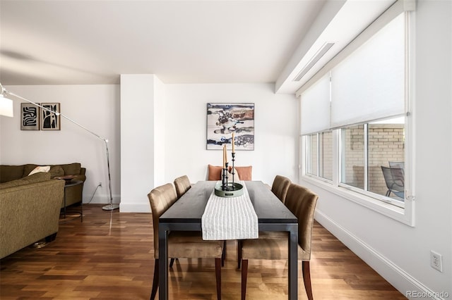 dining area featuring dark hardwood / wood-style flooring