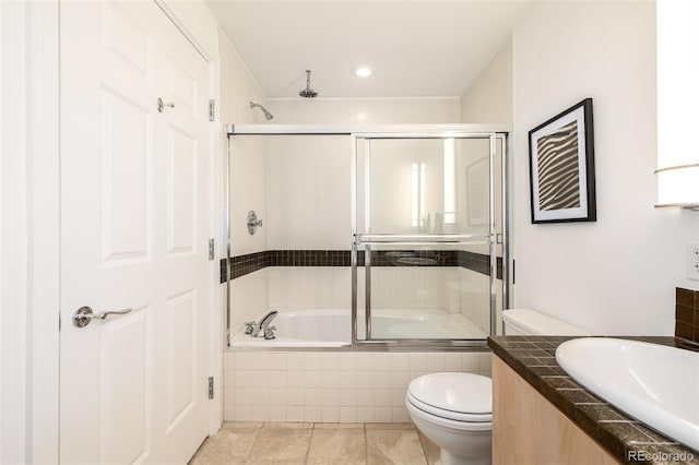 full bathroom featuring toilet, bath / shower combo with glass door, tile patterned flooring, and sink