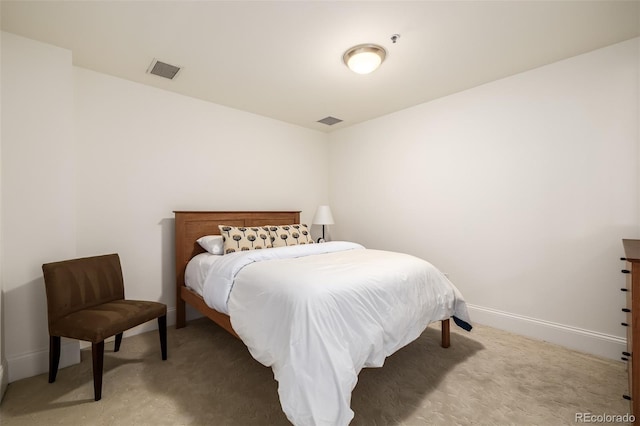 bedroom featuring light carpet