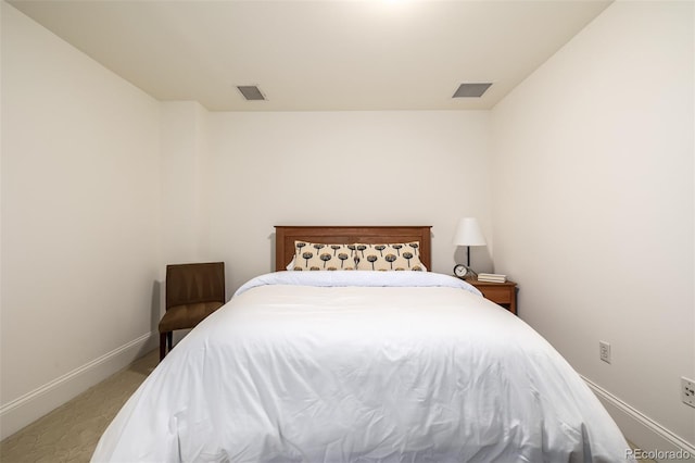 bedroom with light colored carpet