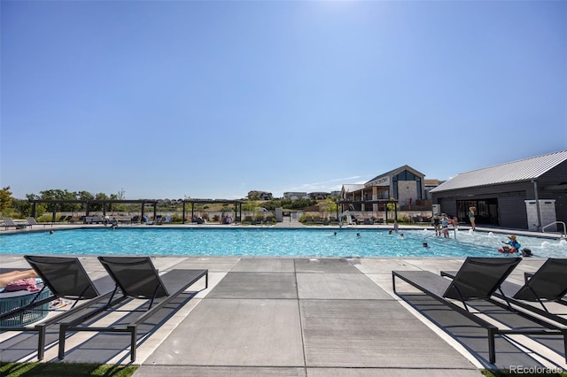 view of swimming pool with a patio area