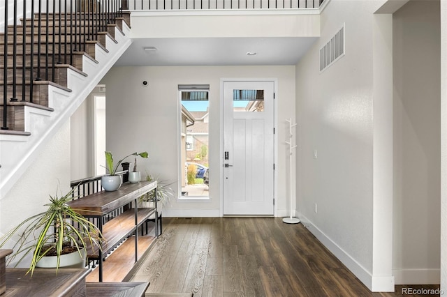 foyer with dark hardwood / wood-style floors