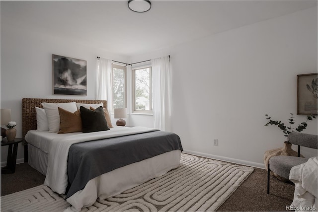 916 Florence St, Aurora, CO 80010 - bedroom with light carpet and baseboards