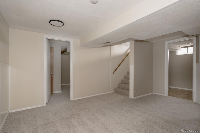 916 Florence St, Aurora, CO 80010 - below grade area featuring carpet floors and stairway