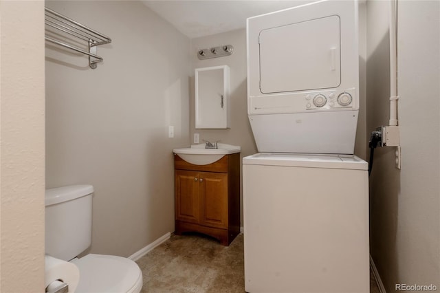 916 Florence St, Aurora, CO 80010 - bathroom with estacked washer and dryer and vanity
