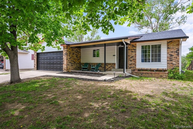 3881 S Bahama St, Aurora, CO 80013 - ranch-style house with brick siding, an attached garage, and driveway