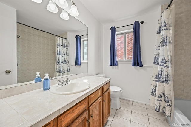 3881 S Bahama St, Aurora, CO 80013 - full bath with toilet, tile patterned floors, vanity, and shower / bath combo