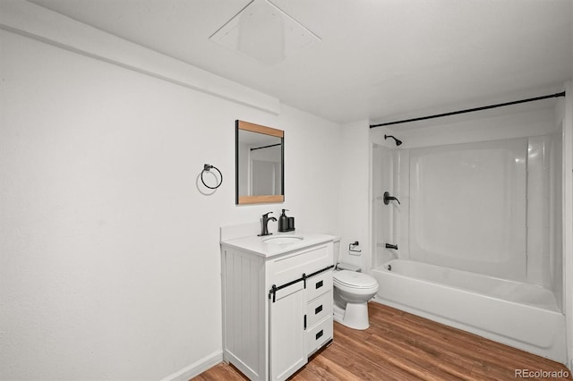3881 S Bahama St, Aurora, CO 80013 - bathroom featuring wood finished floors, toilet, vanity, and shower / bath combination