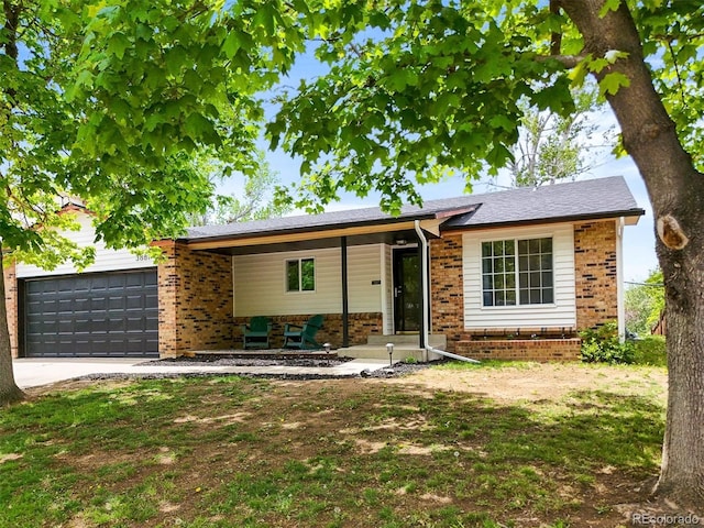 3881 S Bahama St, Aurora, CO 80013 - single story home with brick siding, an attached garage, concrete driveway, and a porch