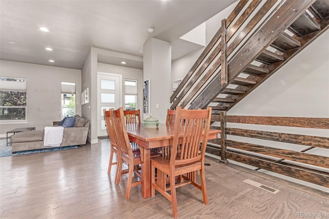 5834 Beeler Ct, Denver, CO 80238 - dining area featuring recessed lighting, stairs, and wood finished floors