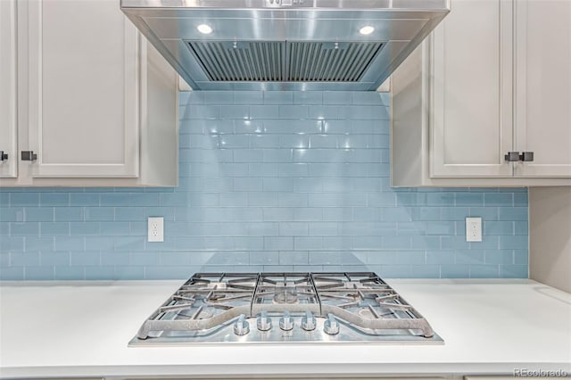 5834 Beeler Ct, Denver, CO 80238 - kitchen with exhaust hood, stainless steel gas stovetop, light countertops, and decorative backsplash
