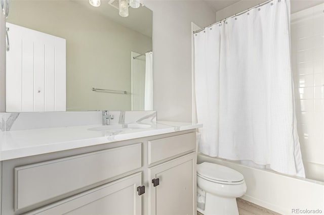 5834 Beeler Ct, Denver, CO 80238 - bathroom featuring vanity, shower / bath combo, and wood finished floors