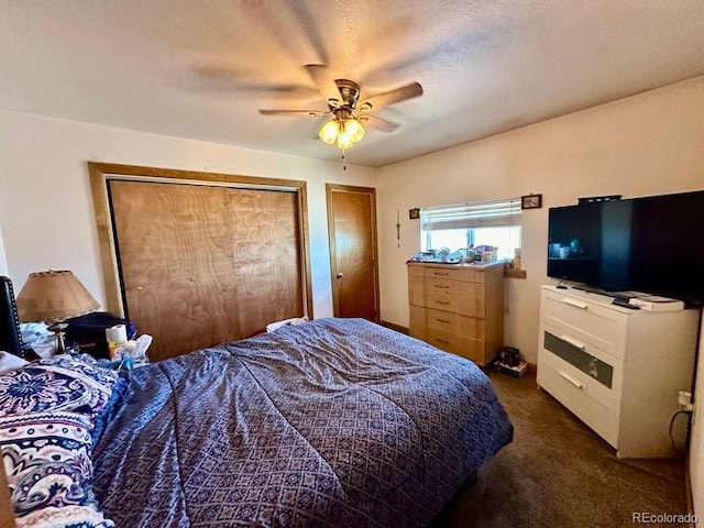 bedroom featuring dark carpet and ceiling fan