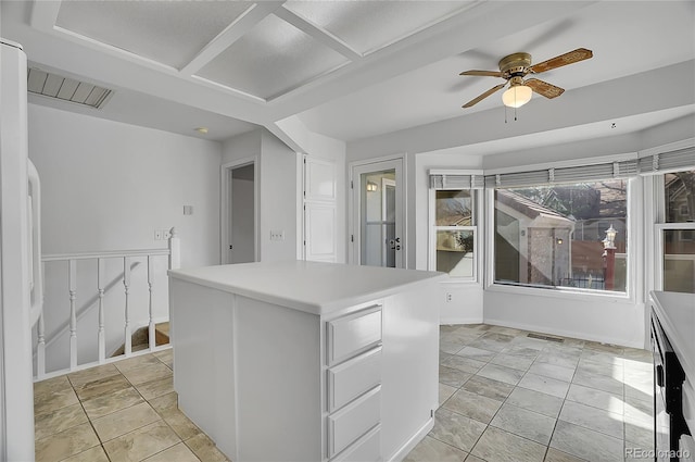 interior space featuring ceiling fan and visible vents