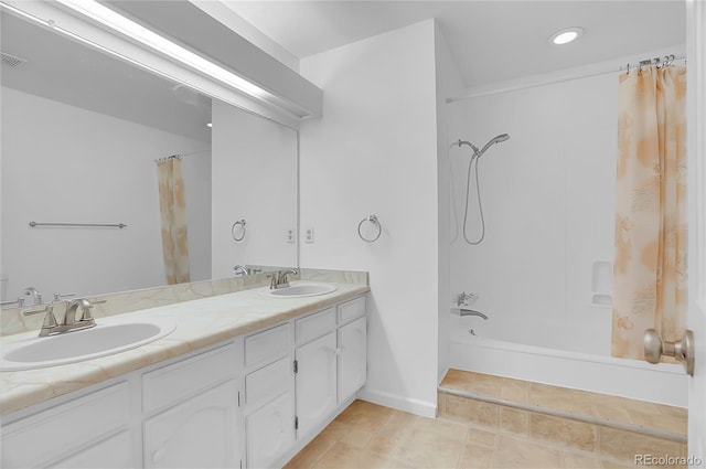 bathroom featuring shower / bath combination with curtain, tile patterned floors, a sink, and double vanity