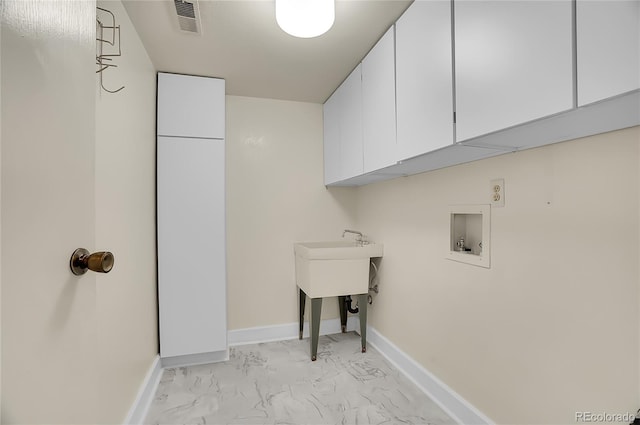 clothes washing area featuring cabinet space, baseboards, visible vents, marble finish floor, and washer hookup