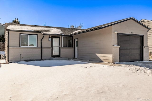 ranch-style home with a garage