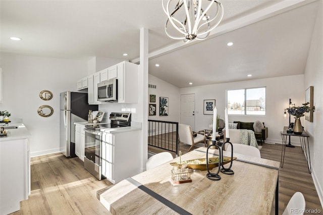 dining space with lofted ceiling with beams, light wood-style floors, baseboards, and recessed lighting