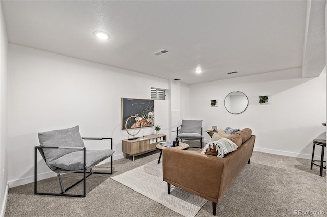 living room featuring baseboards, visible vents, and carpet flooring