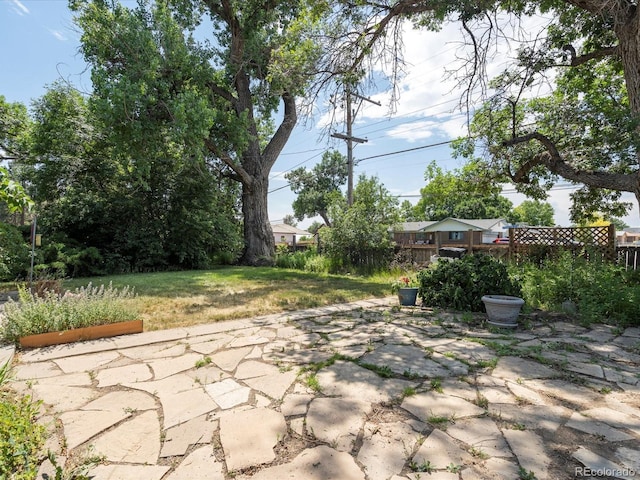 view of patio featuring fence