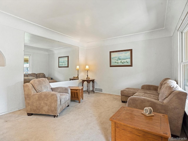 living room with carpet floors and visible vents