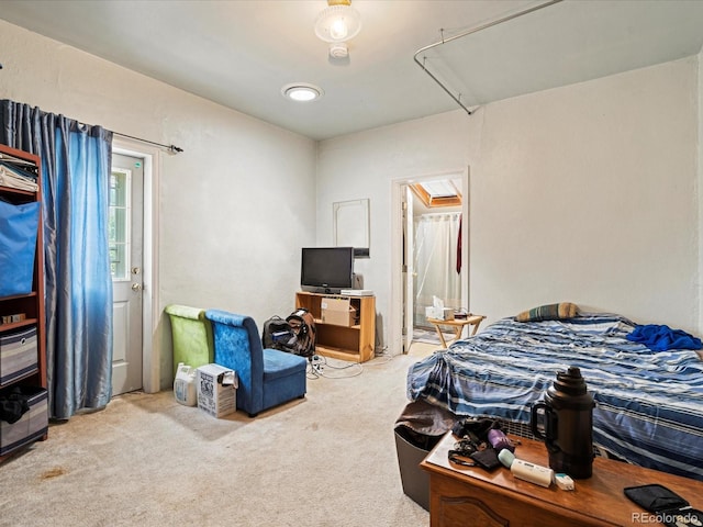 carpeted bedroom with attic access