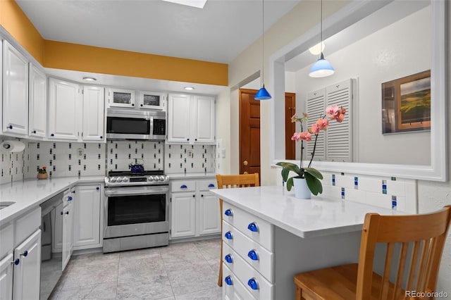 1322 Wicklow St, Boulder, CO 80303 - kitchen featuring appliances with stainless steel finishes, tasteful backsplash, white cabinetry, and light countertops