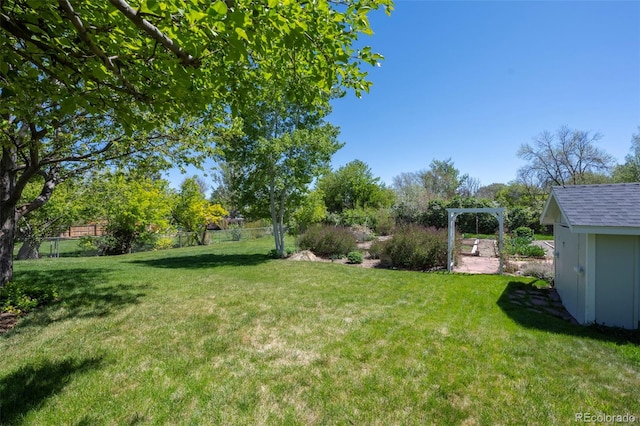 1322 Wicklow St, Boulder, CO 80303 - view of yard with an outdoor structure and a storage shed