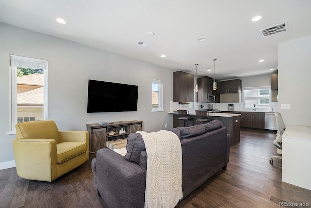 2726 Federal Blvd Unit 1, Denver, CO 80211 - living room with healthy amount of natural light, recessed lighting, and dark wood-style flooring