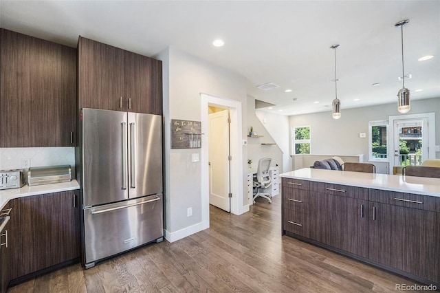 2726 Federal Blvd Unit 1, Denver, CO 80211 - kitchen featuring high quality fridge, light countertops, dark brown cabinets, dark wood finished floors, and open floor plan