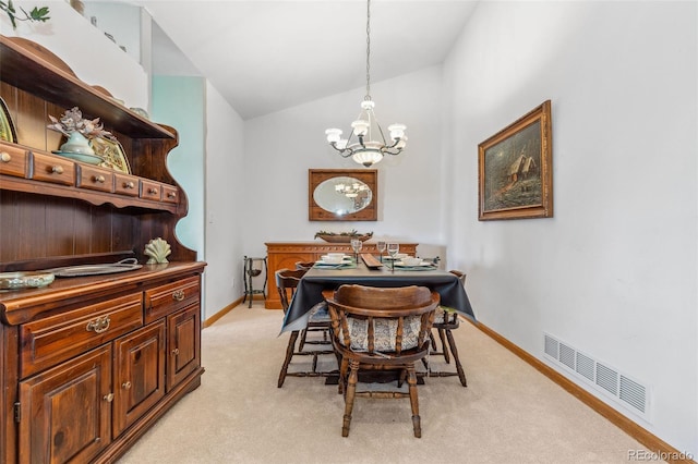 dining area featuring a chandelier, light carpet, visible vents, baseboards, and vaulted ceiling