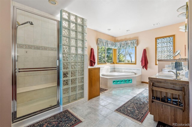 full bath featuring visible vents, a stall shower, vanity, a bath, and tile patterned floors