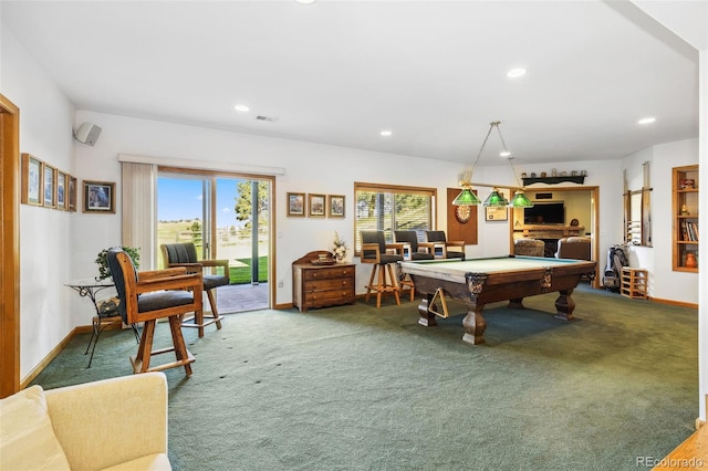 recreation room with carpet floors, plenty of natural light, and visible vents