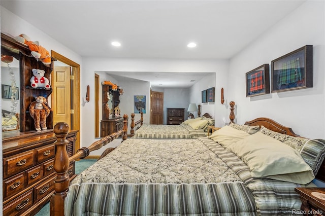 bedroom with recessed lighting and carpet
