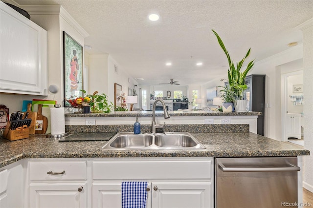 kitchen with sink, a textured ceiling, white cabinetry, ceiling fan, and crown molding