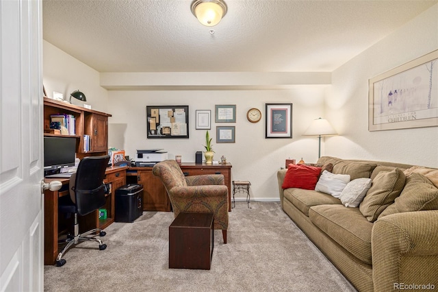 carpeted office space featuring a textured ceiling