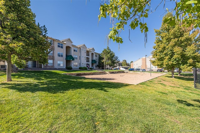 view of home's community featuring a yard