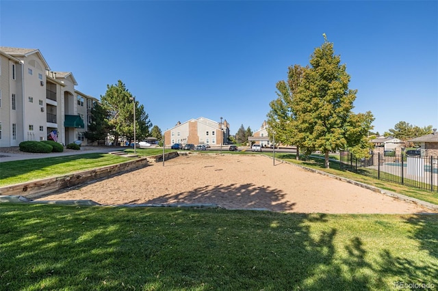 view of property's community featuring a lawn