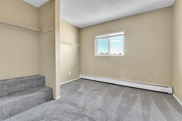 interior space with a baseboard radiator and carpet