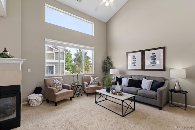 15125 E Bayaud Pl, Aurora, CO 80012 - carpeted living area with high vaulted ceiling, a tile fireplace, and ceiling fan