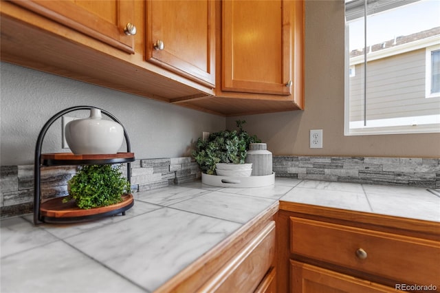 15125 E Bayaud Pl, Aurora, CO 80012 - kitchen view of brown cabinets and tile counters