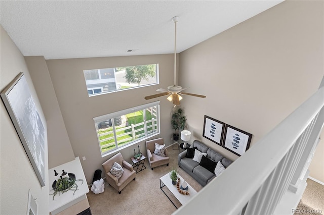 15125 E Bayaud Pl, Aurora, CO 80012 - living area with carpet flooring, plenty of natural light, ceiling fan, and a high ceiling