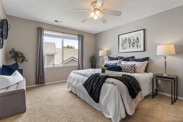 15125 E Bayaud Pl, Aurora, CO 80012 - bedroom featuring light carpet, a textured ceiling, and ceiling fan