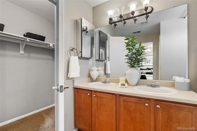 15125 E Bayaud Pl, Aurora, CO 80012 - full bathroom with double vanity and baseboards