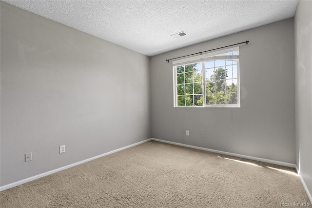 15125 E Bayaud Pl, Aurora, CO 80012 - carpeted spare room with baseboards and a textured ceiling